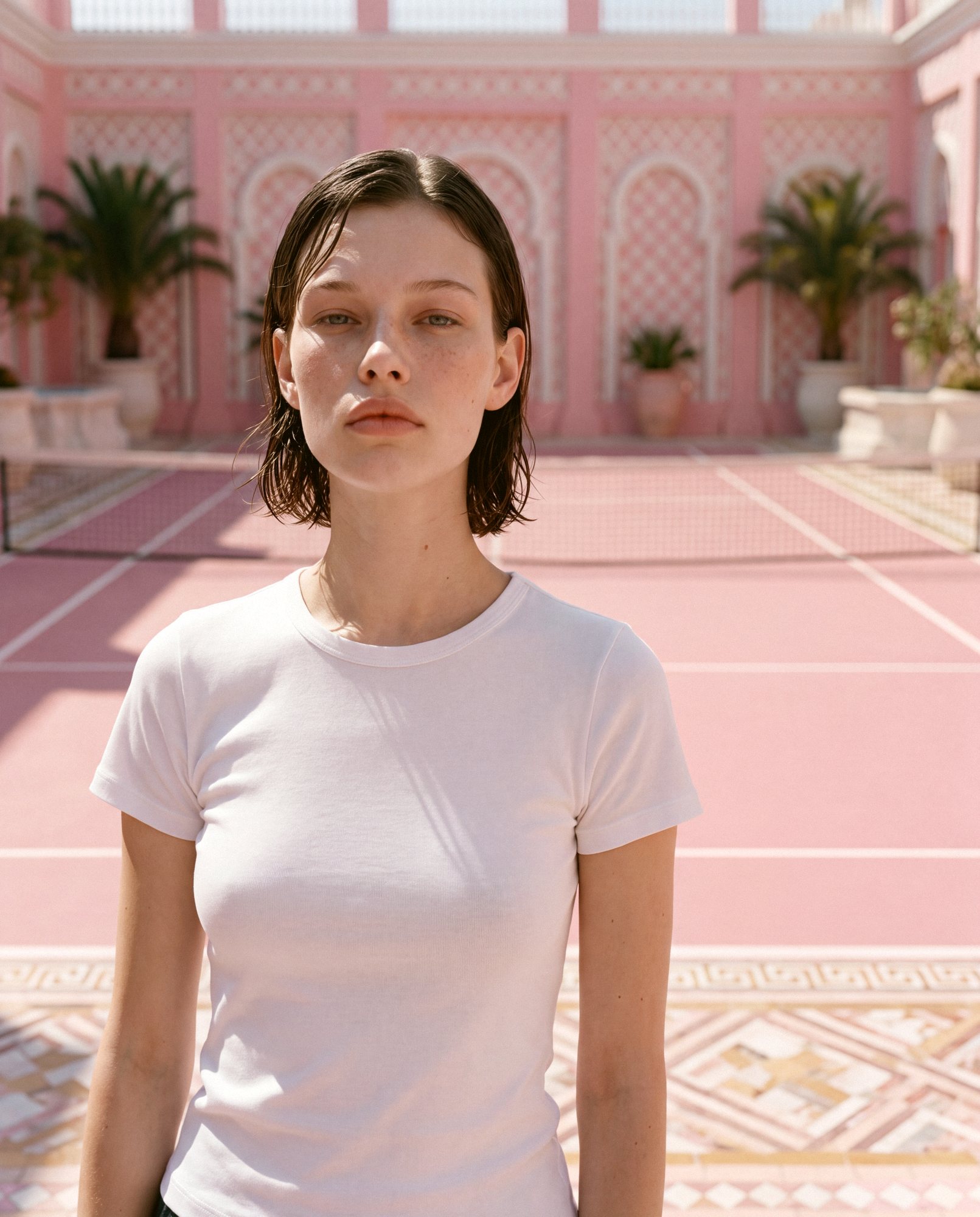 DWELLER Basic T-Shirt on a pink tennis court — Tennis Club campaign